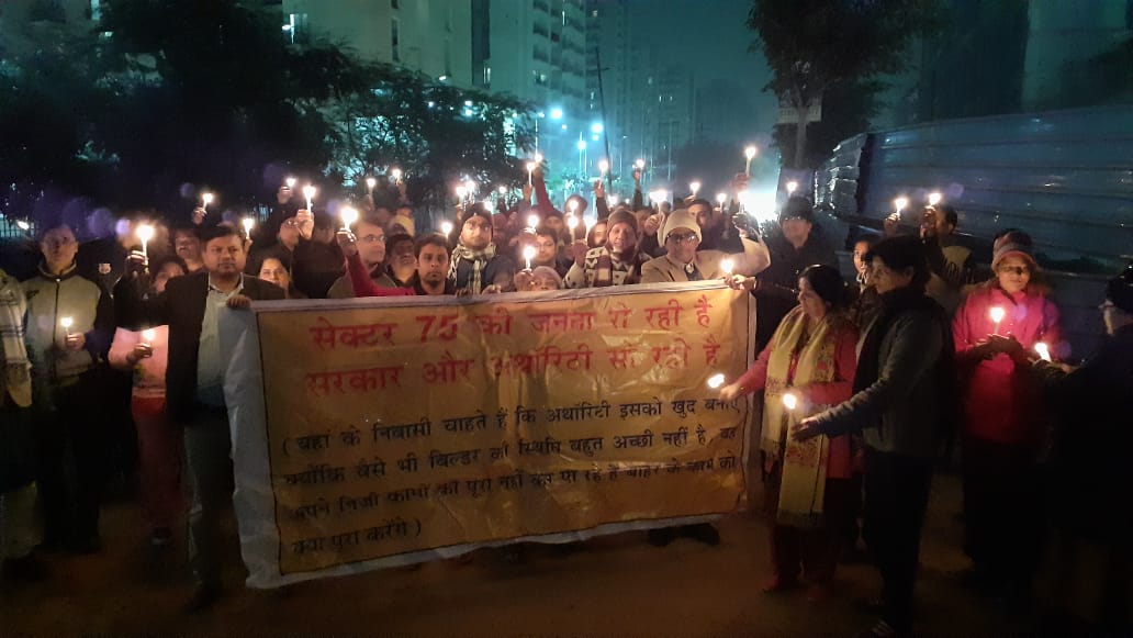 75_sec's tweet photo. Candle light march for the development of sec 75 Noida. 
#sec75noida #hungerstrike https://t.co/ZSrQizvxND