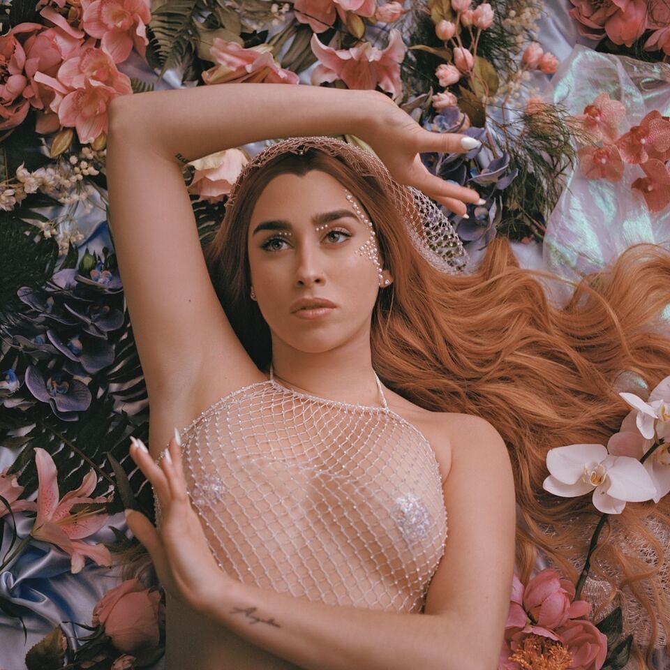 Sony's tweet photo. It's been exactly a year since @LaurenJauregui dropped the "More Than That" video and we're still not over it. #thelookback https://t.co/kFL4Zb9Cru