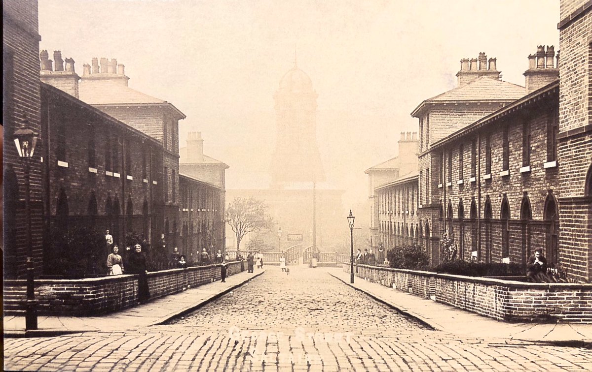SaltsWalks's tweet image. The houses at the bottom of George St never had railings. Great shot of the iron footbridge to Platform 1 on #Saltaire Station. A popular pitch for #trainspotting &amp;amp; children waiting for steam engines, it was removed after the station was closed in 1965. #Beeching