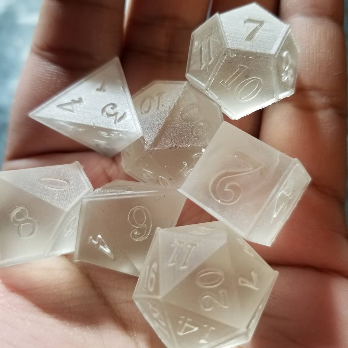 New master dice! These are pretty much the same as my old ones but with some tweaks. Here are some images of what each stage looks like to get the final result.

Thank you <a href="/thebluemimic/">thebluemimic</a> for making me this lovely set of dice!

#dice #dnd #polyhedraldice #resindice #ttrpg