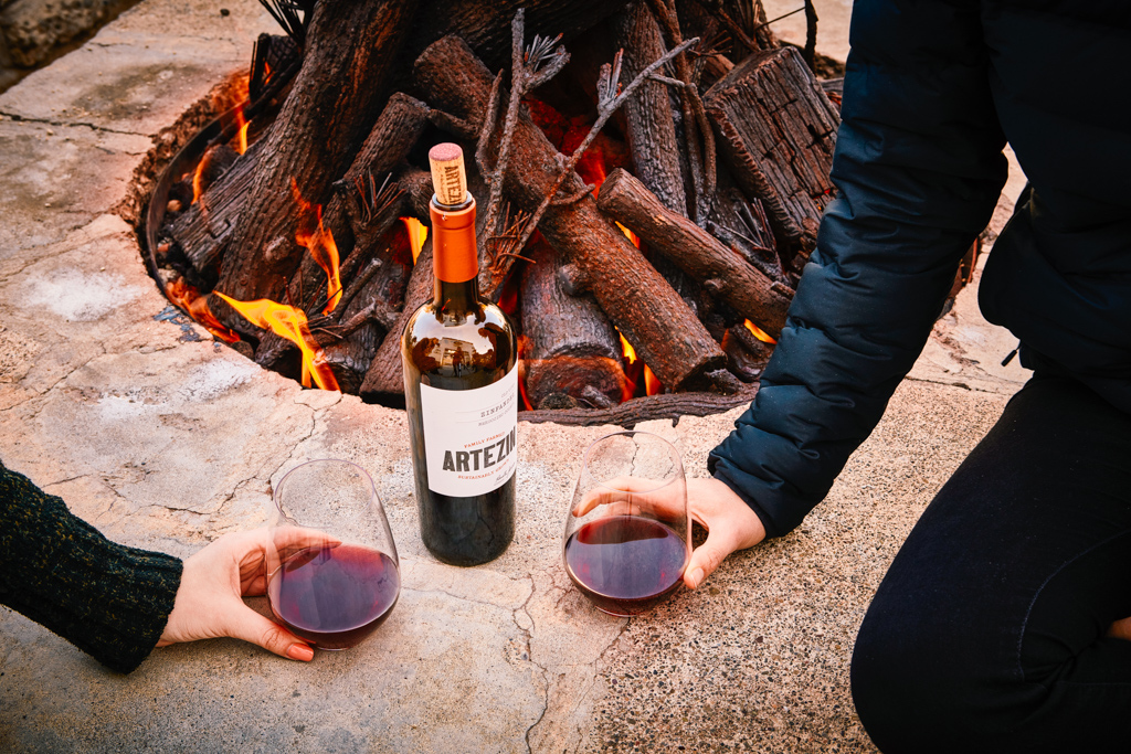 Chilly winter nights are best spent by a cozy fire with a few friends sharing a bottle of Artezin wine.