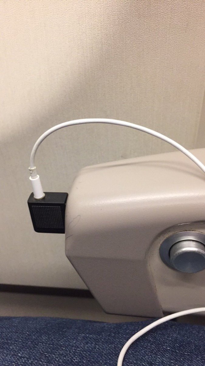 Mono to stereo 1/8” audio adapter connected from an A330 armrest to stereo headphones