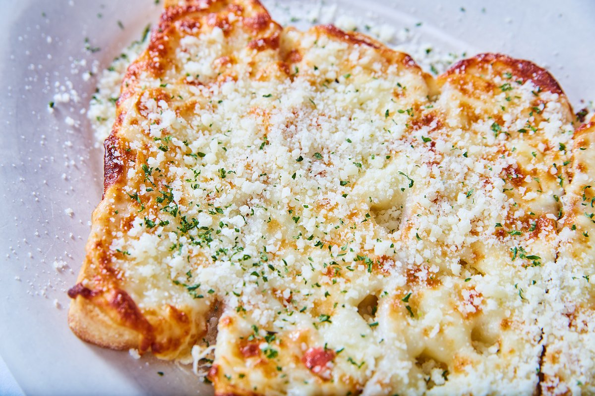 Our Garlic Cheese Bread comes on toasted ciabatta bread topped with garlic butter and melted mozzarella.