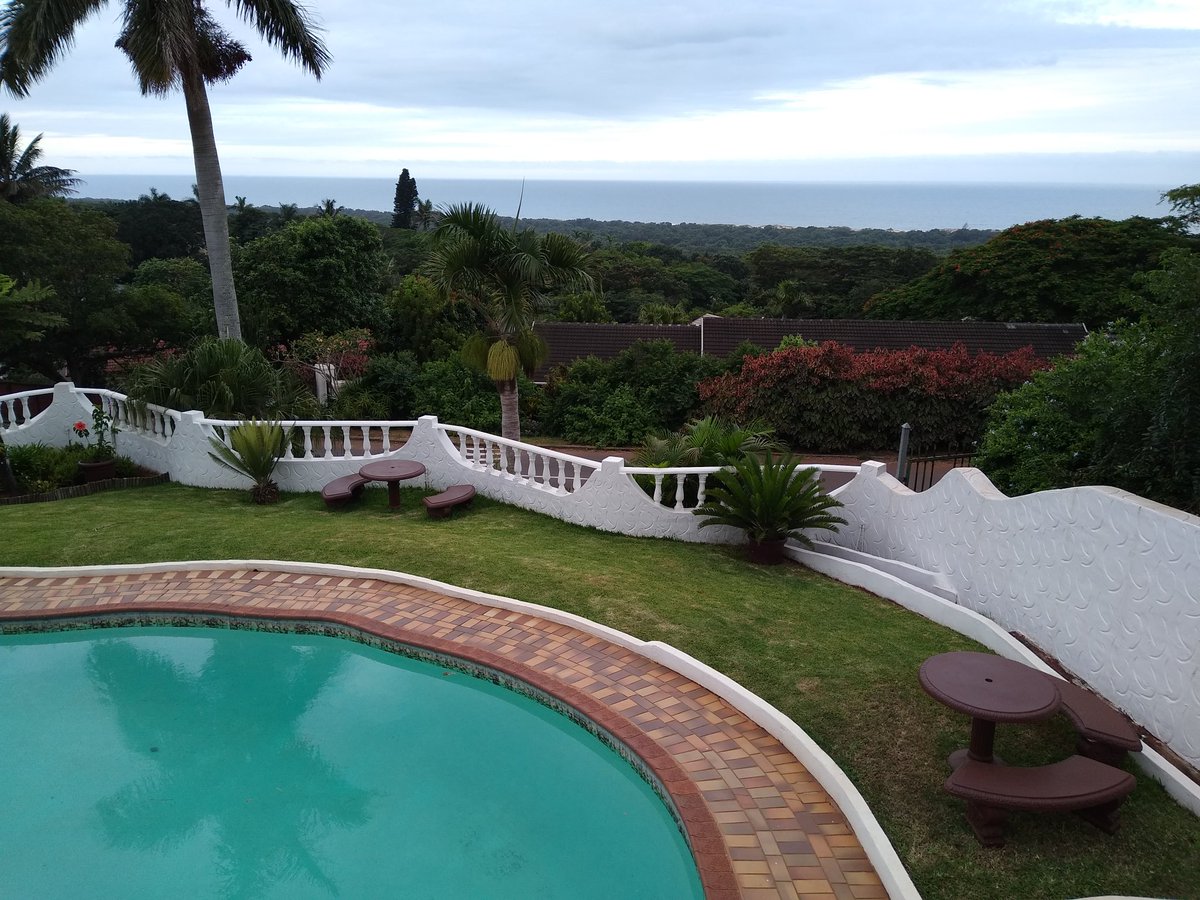 S_K_Wilson's tweet photo. Slightly unexpectedly, almost exactly 24 hours after running in the mud and rain in Stirling, I'm looking out to sea from Mtunzini in South Africa ahead of the Maths in Industry Study Group starting tomorrow! #mathsinindustry @StrathMathStat https://t.co/I85HfAqKWH