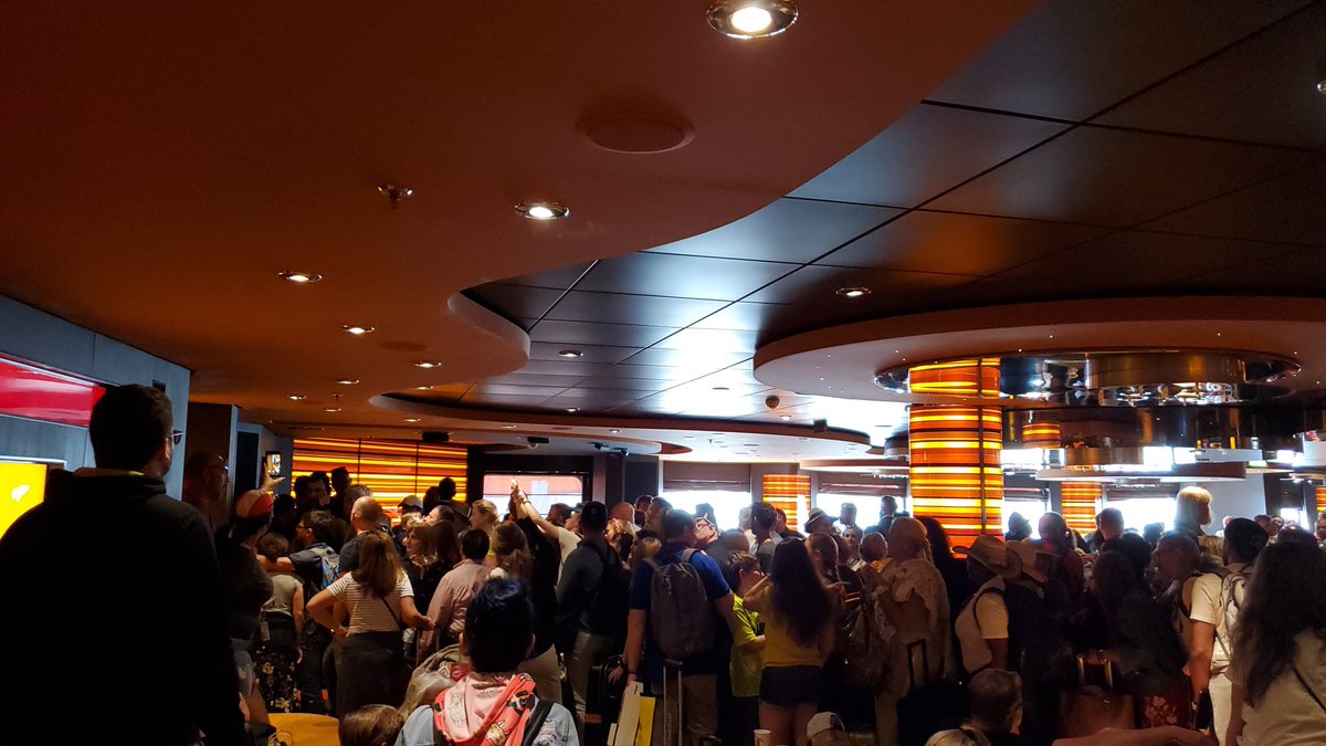 This was the line to exit #mscdivina. I have never felt so unsafe for my family in a cruise due to the lack of staff to provide direction and order.