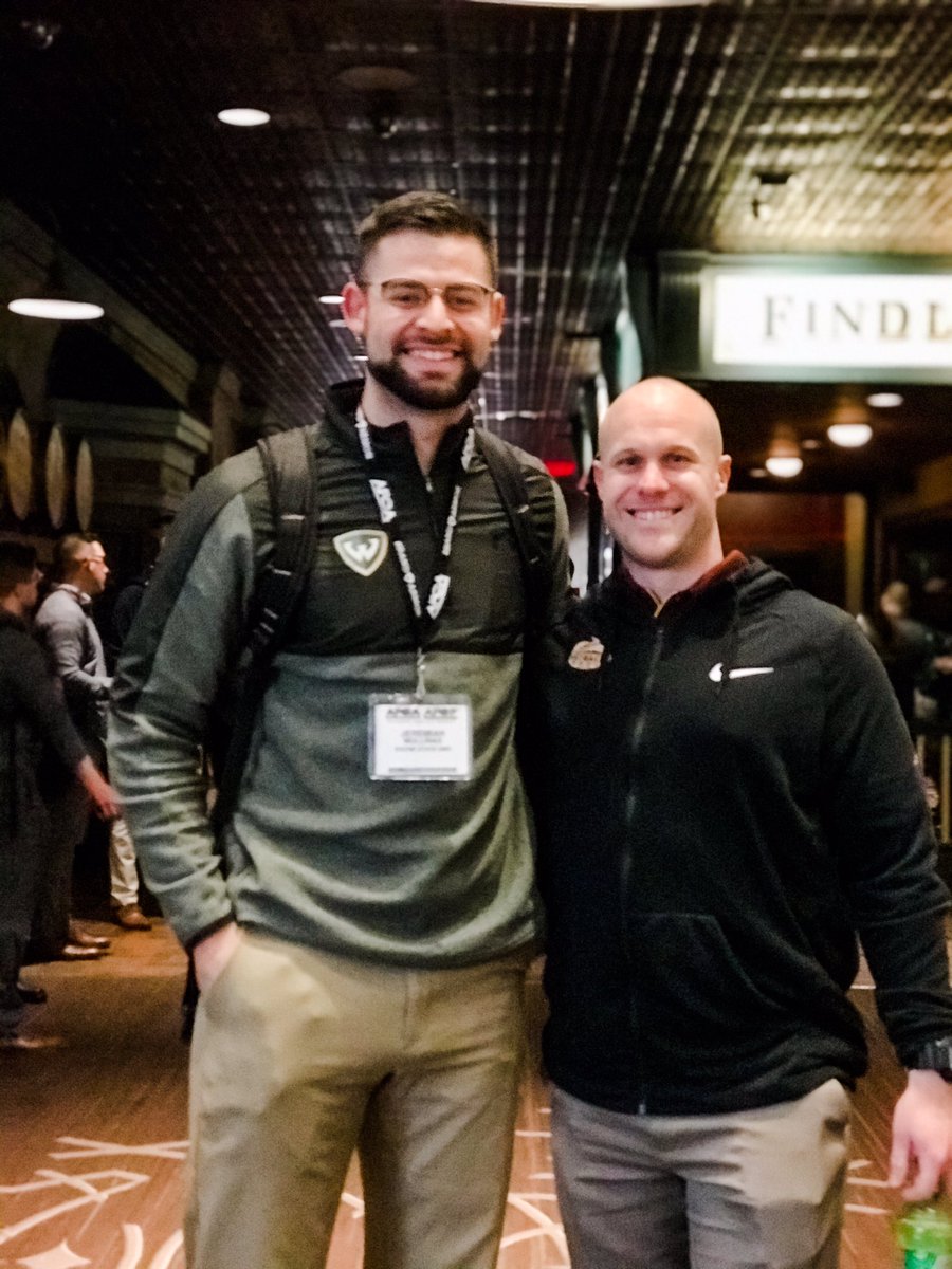 HeyJacquiRae's tweet photo. I’m so happy I could tag along with the hubs this year for the 🏈 convention. It’s been amazing bumping into past assistants, but extra special seeing this guy! Former player turned coach @Coach_Mullinax! Makes my #MamaJuice heart so happy. #OriginalGoon https://t.co/WpOud0onY7