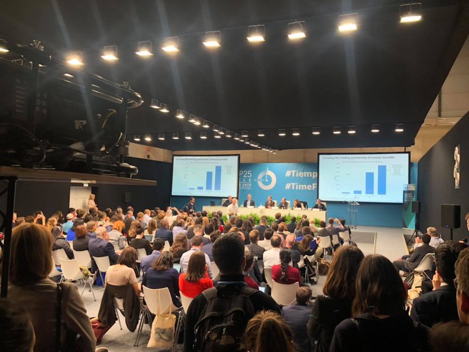 Photo of crowd attending a panel discussion