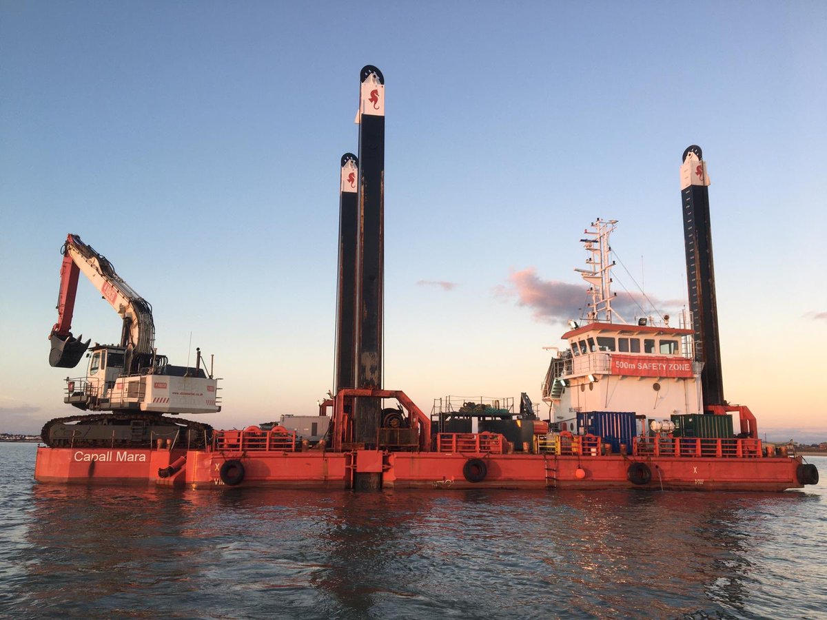Capall Mara backhoe dredger backfilling in the winter sun #abco #abcomarine #capallmara