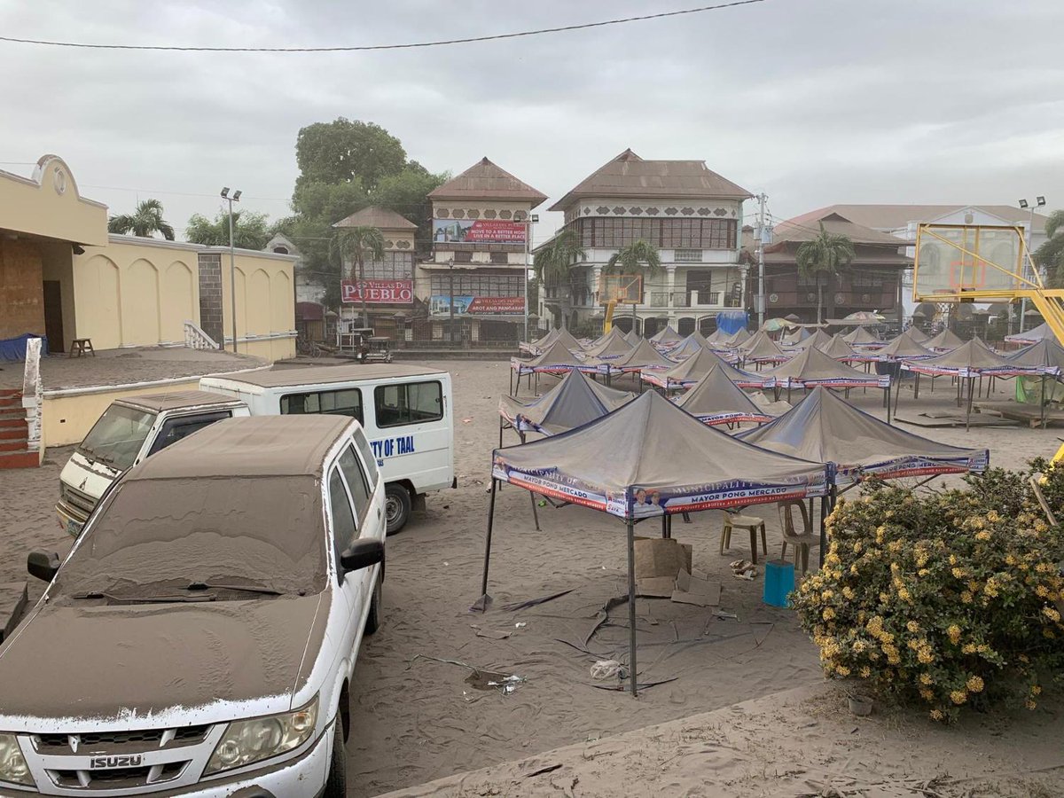 rapplerdotcom's tweet photo. LOOK: The municipality of Taal under a thick layer of ash. The only signs of life are mostly the ongoing evacuations. 

Photos by Loreben Tuquero/Rappler #TaalVolcano #TaalEruption2020 https://t.co/u3uN3fr4HE