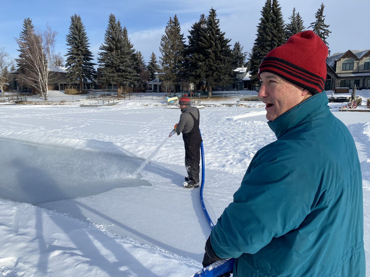 LakeBonaventure's tweet photo. Volunteer helping Matt flood skating path. It’s been a tough year preparing the ice for skating. Matt estimates he put in 600 hours last winter cleaning sidewalks and ice. https://t.co/M87tcIUatR
