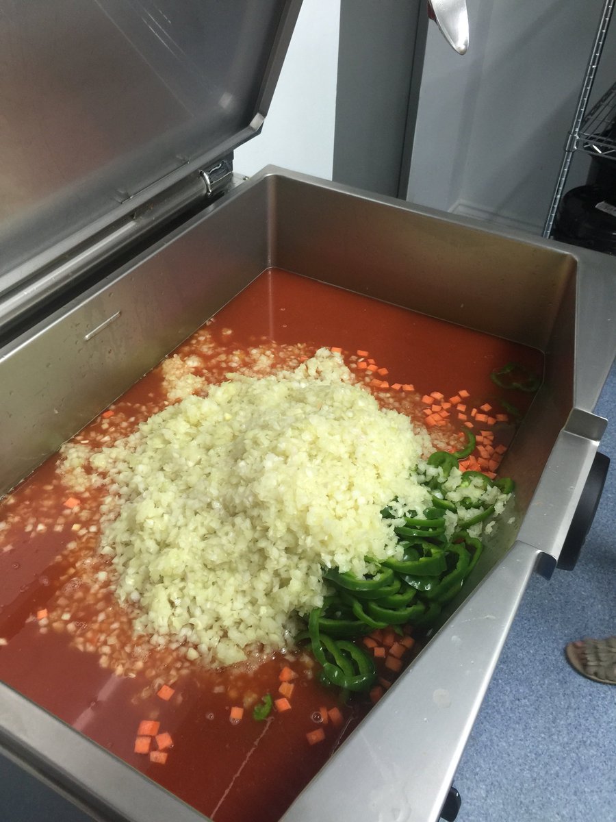 BoOMRevolution's tweet photo. .@shaunwkeaveny finally a decent forum for #onionchat !! Here’s my daughter working on her very first batch of boom base, an onion based curry gravy which takes us 17 hours - 19 hours to dehydrate depending on the moisture content in the onions. https://t.co/PPQj9RYnkx