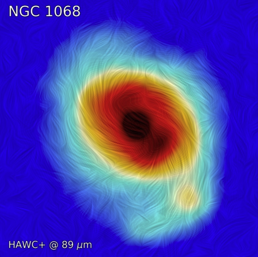 A three-tone image depicts an 89µm view of a spiral galaxy, showing small hairs of polarization that indicate the direction of the magnetic field throughout the galaxy.