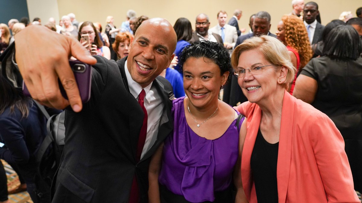 Elizabeth Warren and Cory Booker take a selfie.