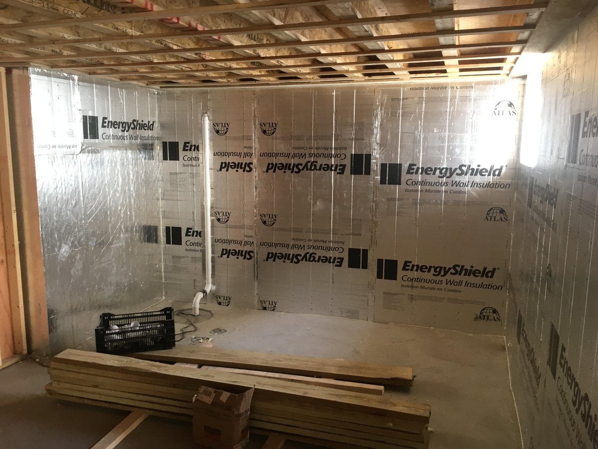 SH_Construction's tweet photo. Four inches of foil-faced rigid insulation (XPS) around the perimeter of this new foundation wall, taped and sealed, makes for a tight, snug basement. #SHConstruction #Construction #Insulation #BasementInsulation https://t.co/2vIORcr5cZ