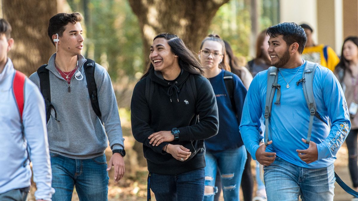 Students talking to each other while walking