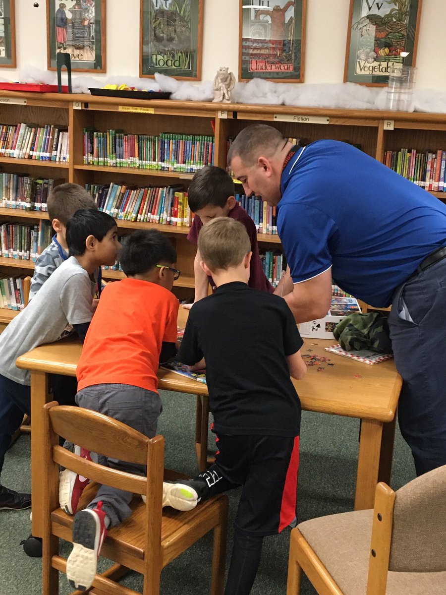 LibraryEmerick's tweet photo. Mr. Cramer and some awesome 2nd graders working on a puzzle during library today. #passiveprogramming @emerickelem1967 @AllderAllStars https://t.co/qfXaFLoNgX