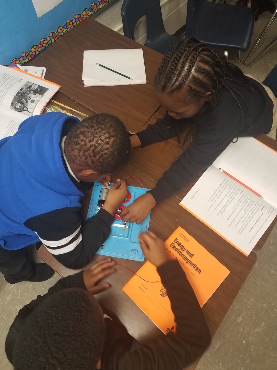 4th graders collaborating to develop a circuit system to light 2 bulbs instead of just 1. <a href="/PriceOwls/">Price Elementary</a>