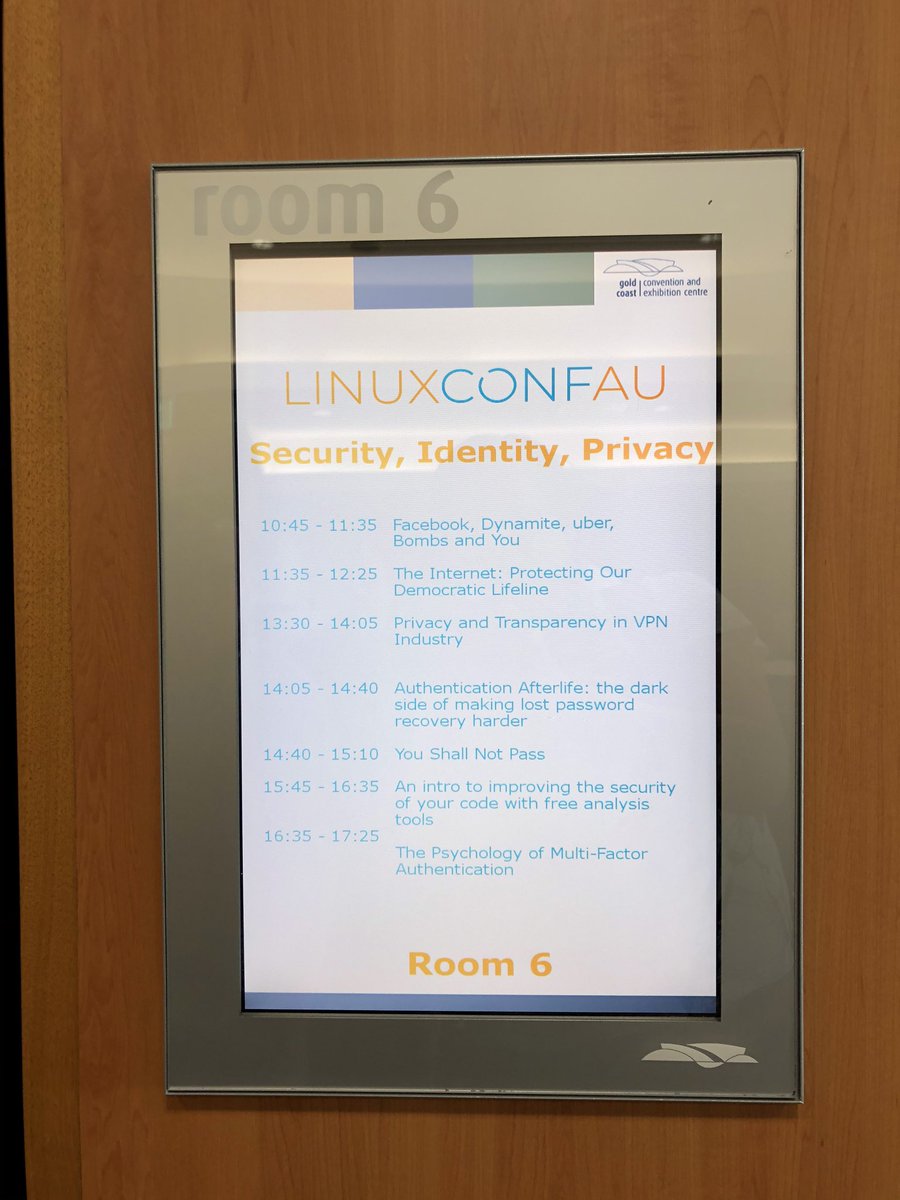 Security, Identity, and Privacy Miniconf schedule on the LCD screen outside room 6
