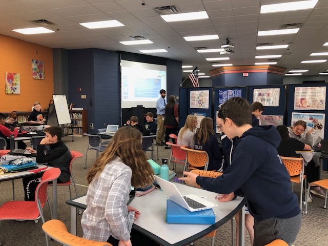 LDSspotlight's tweet photo. The Nagel Learning Commons is a busy place!  Mrs. Yousuf and Mr. Fogelson combined their seventh grade social studies classes for an engaging and interactive trade simulation--complete with trade routes and a trading hub. #Nagelbethechange #WeareFHSD https://t.co/as2ufUOMOZ