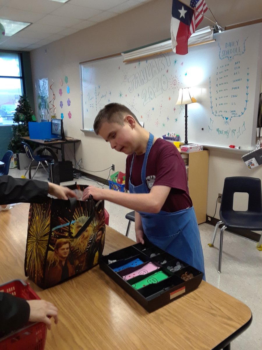 TJHS_Tara's tweet photo. Practicing bagging and cashier job skills- He has the best customer service smile! https://t.co/BpsbITf7U5