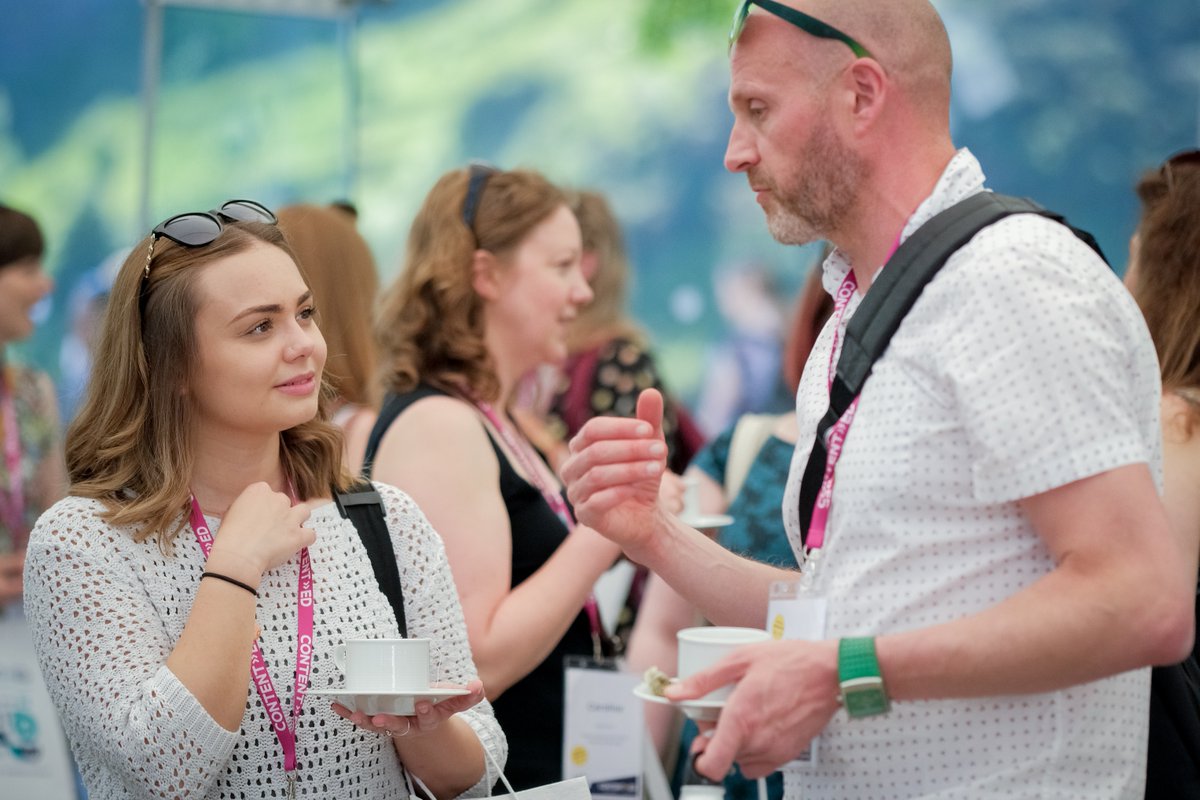 Two delegates having a conversation at ContentEd19.