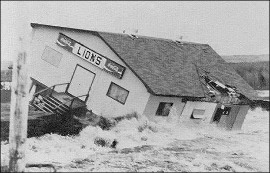 Pic of the Lion's Club, Bishop's Falls being destroyed by the raging waters of the Exploits River January 14, 1983. Btwn January 12-14, rainfall exceeding 200mm fell extending north from Head of Bay d'Espoir to the headwaters of the Northwest Gander River.