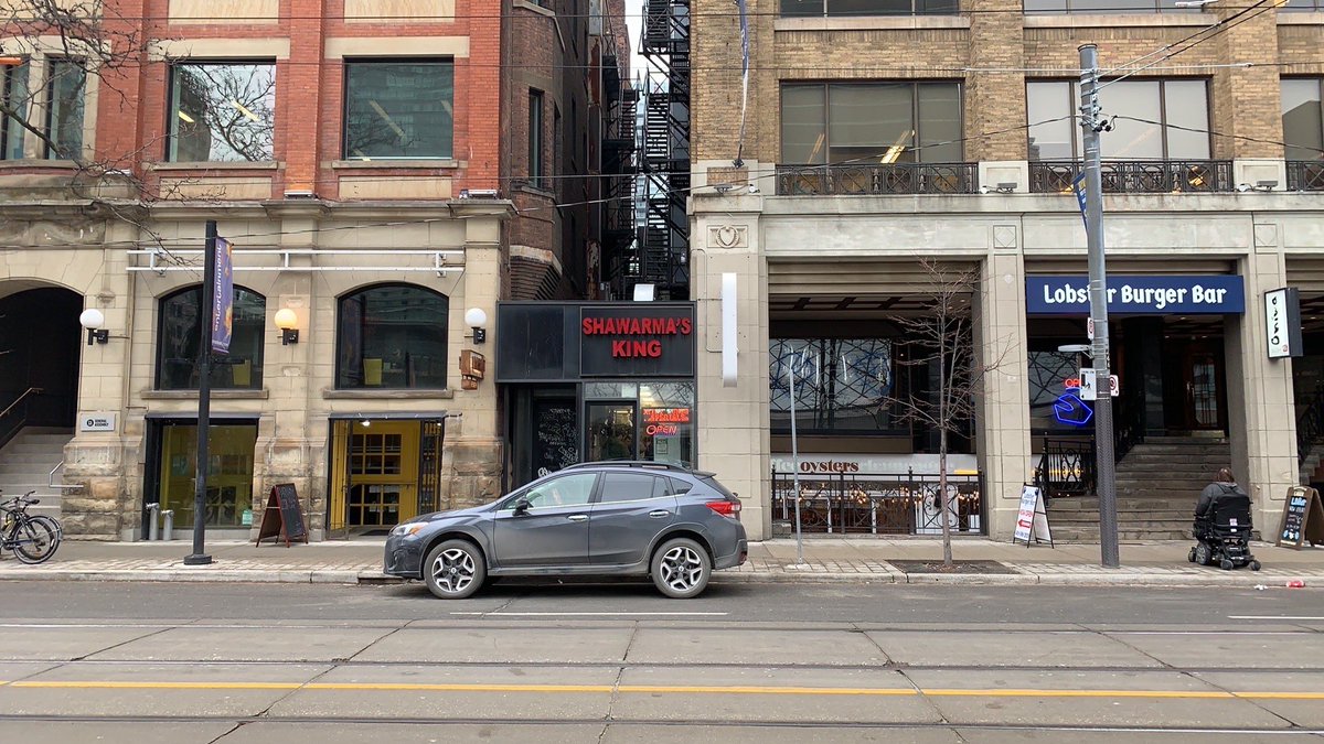 Slinging Shwarma underneath the fire escapes