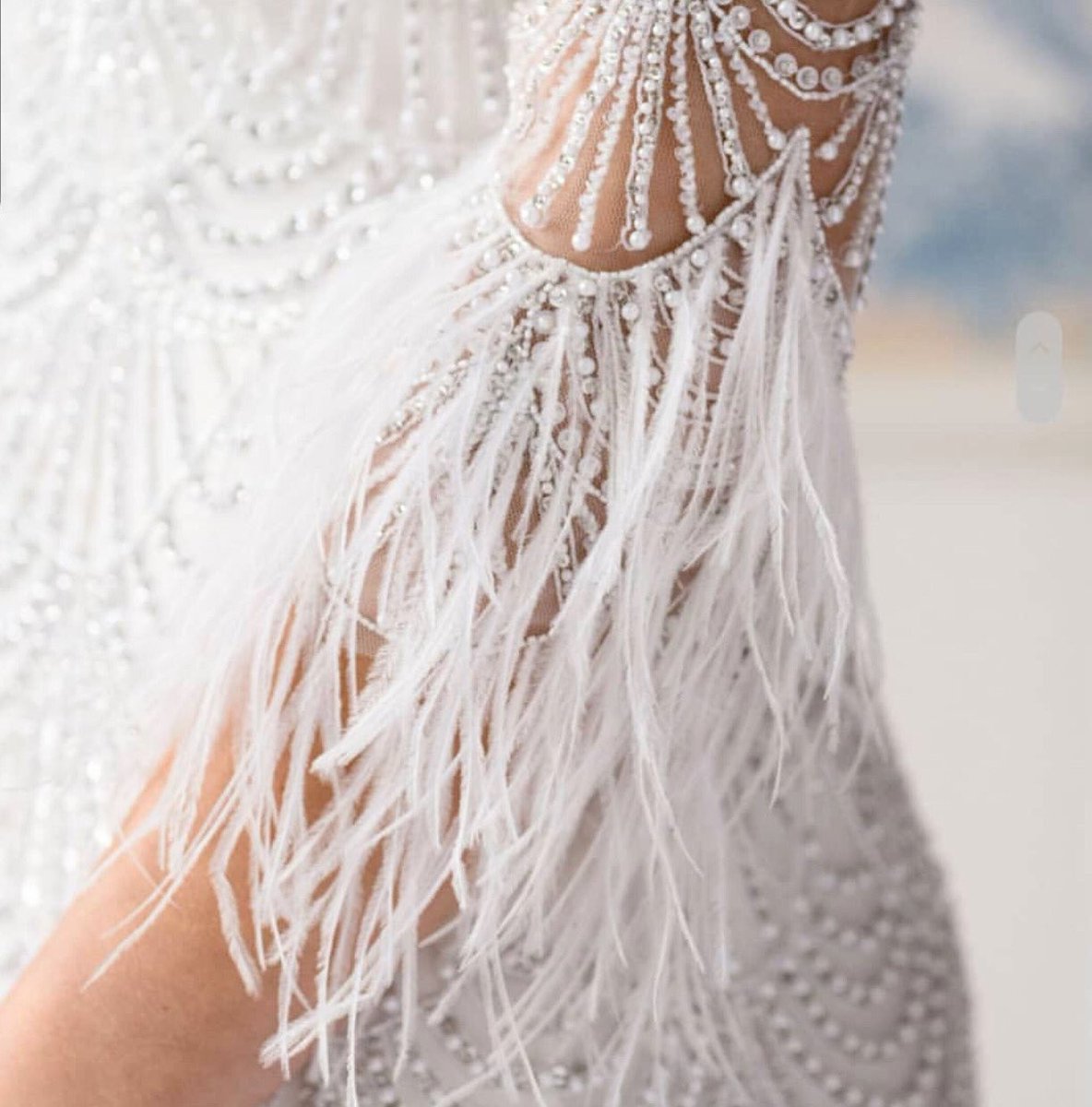 Add drama to your bridal look by opting for a gown adorned with an intricately beaded and feathered design. We’re in love! 💕 📷 by <a href="/ejhbridal/">Eliza Jane Howell</a> &amp; Silverlinings Wedding Guide