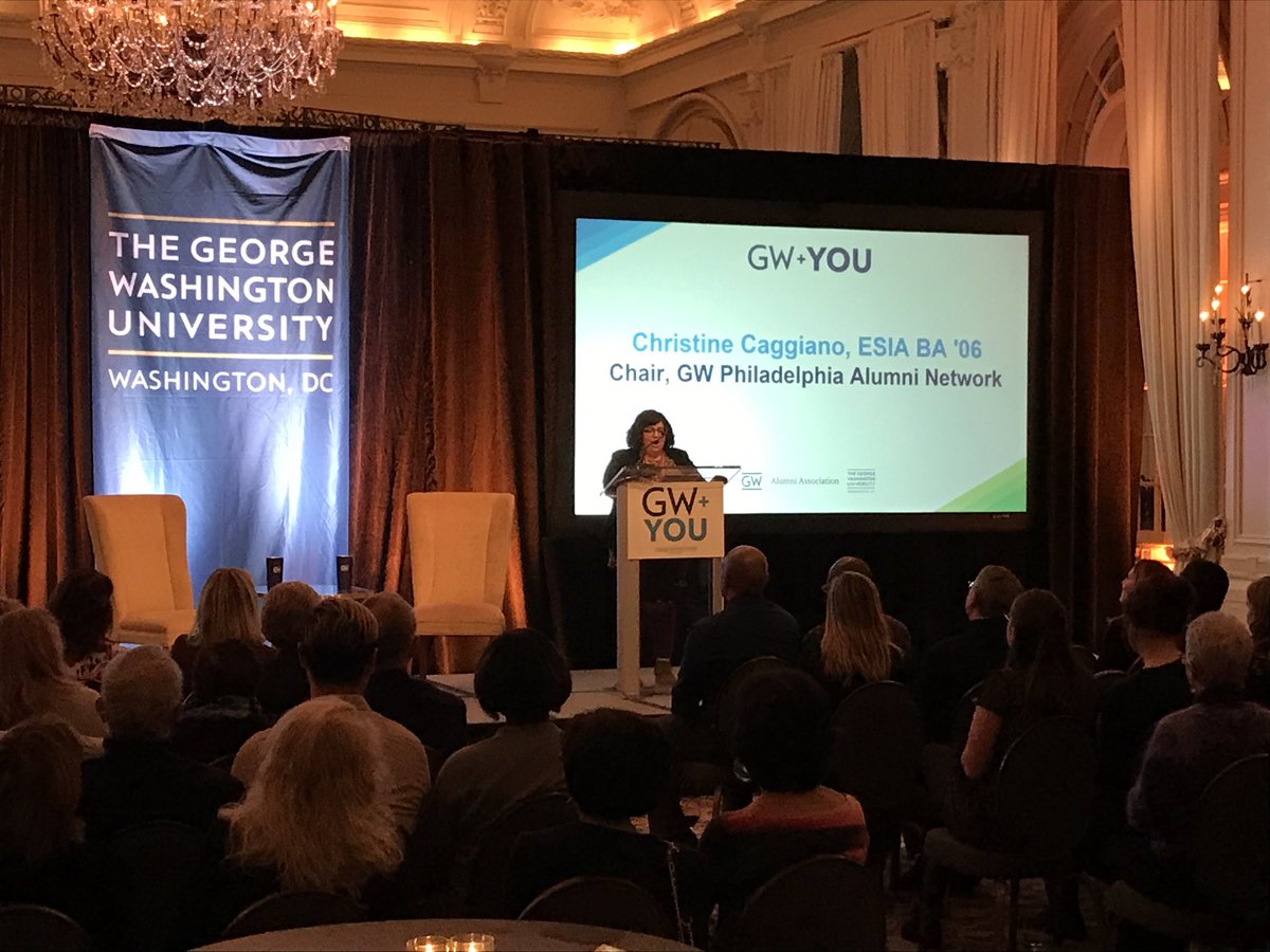 Alumna Crissy Caggiano introduces President LeBlanc and GWAA Executive Committee member Vikram Kuriyan