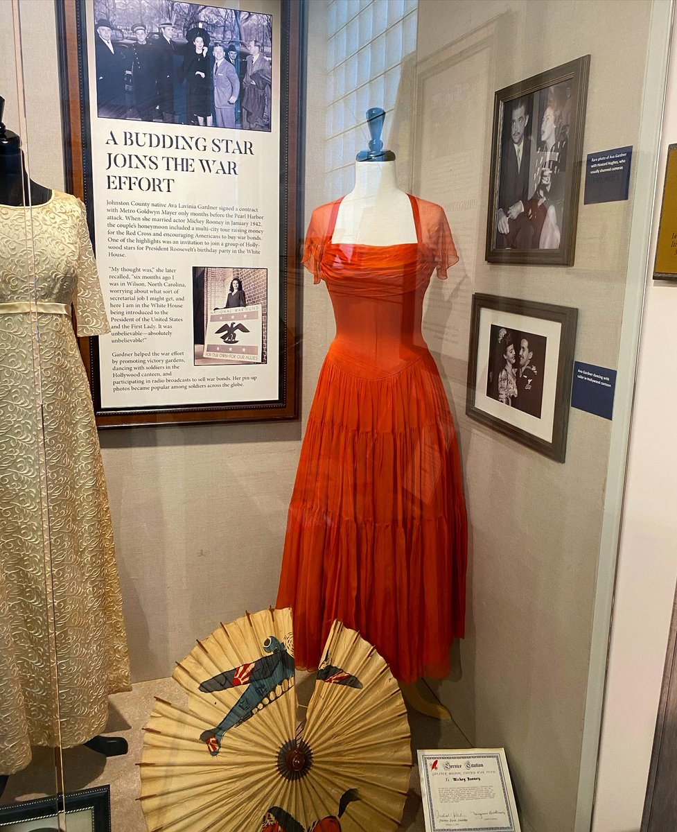 AvaMuseum's tweet photo. A few items #FromTheCollection are currently on exhibit at the @jocoheritage Center, as part of their exhibit about World War II, including this dress given to Ava by Howard Hughes.
#OnExhibit #AvaGardner #visitJoCo #HowardHughes #WWII #AvaGardnerMuseum https://t.co/6n5SUifaMe