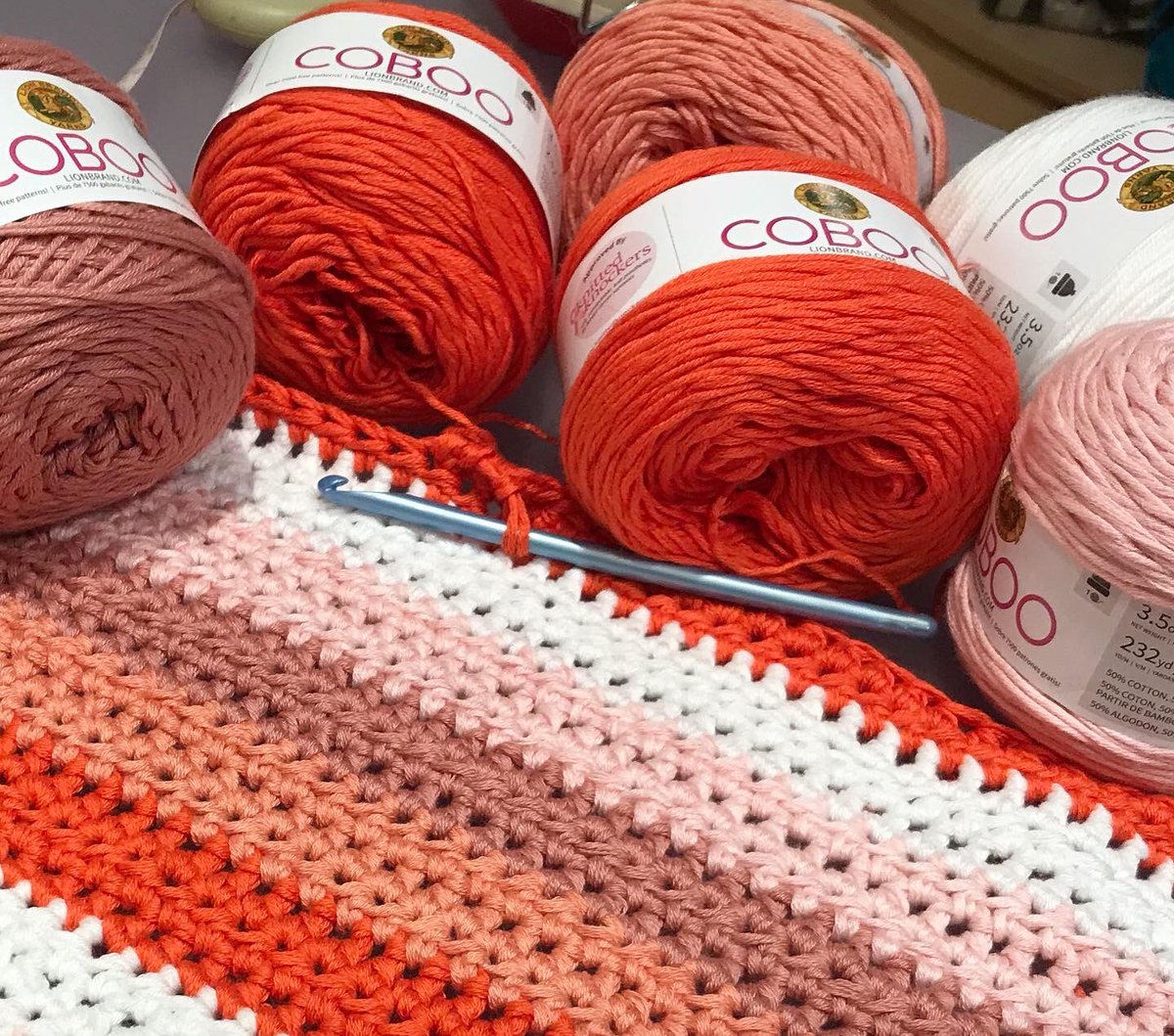 lbystudio's tweet photo. This baby blanket is working up nicely.  This is our Coboo yarn which is 50% cotton and 50% bamboo. There are 232 yards on each cake 🧁 for just $3.99 at the Lion Brand Yarn Studio in Manhattan.  @misterwoolybear is making a baby blanket for a gift made with half double crochet🧶 https://t.co/LiHShak6M8