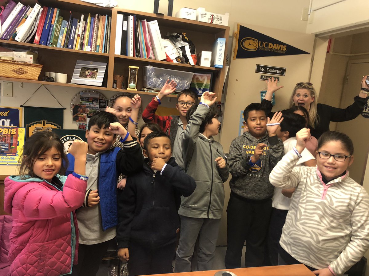 Meet (most of) our Bulldogs with perfect attendance and check out their new bracelets! (And an awesome mom who heard her student’s name announced and photo bombed!)