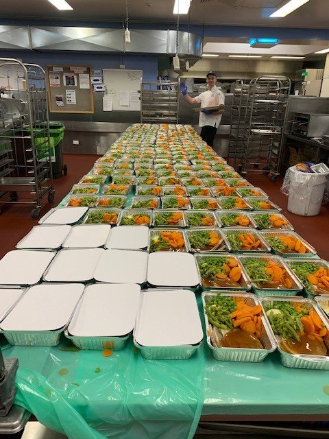 Launceston General Hospital's Food Services team have been busily preparing meals for the Tasmania Fire Service. The meals were delivered to Fingal for those battling the bushfires. Photo: Chef Joel proudly plating up 160 meals.