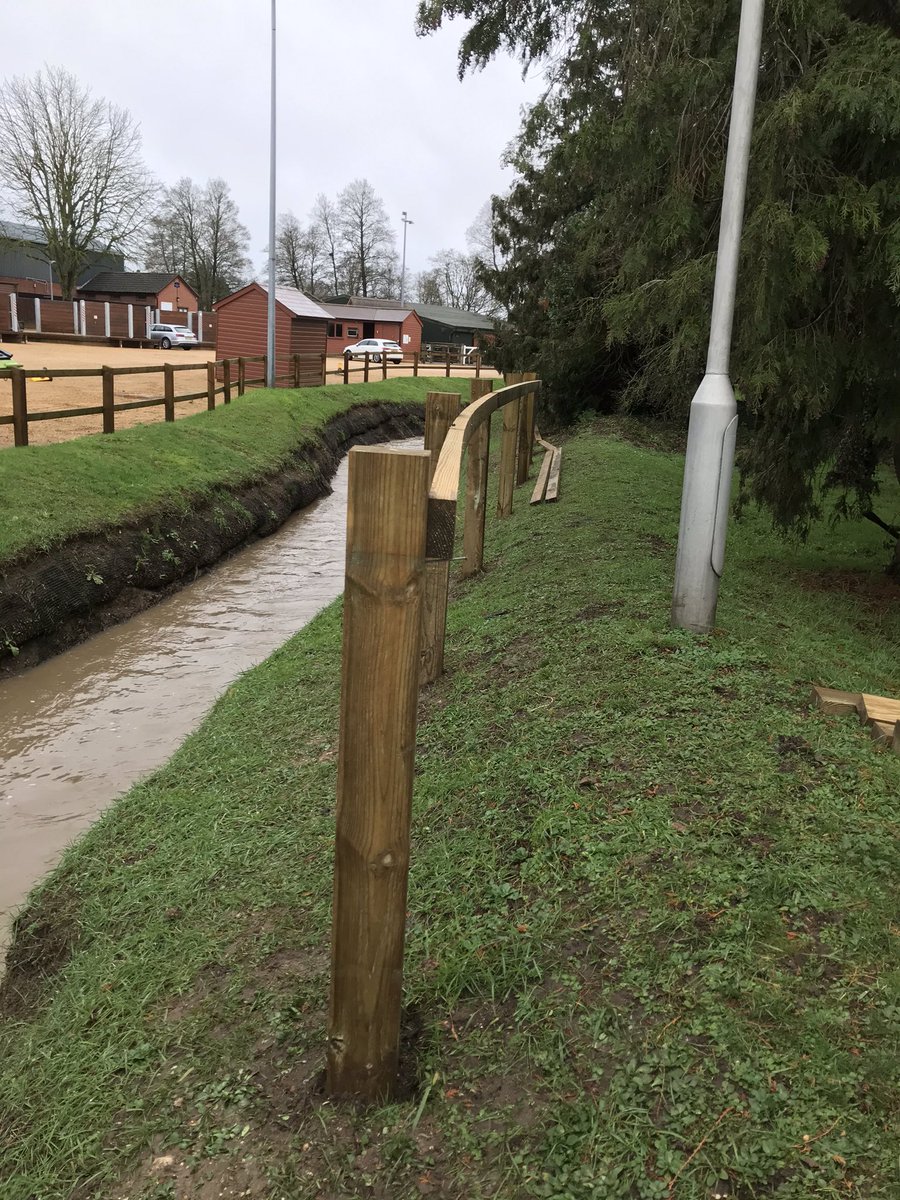 JamesWTMurray's tweet photo. A bit more of a challenge today, on a slippery slope with a rain water overflow surging! #hadenoughofrainnow #dontslip #postandrailfencing https://t.co/du2D8Qh1rH