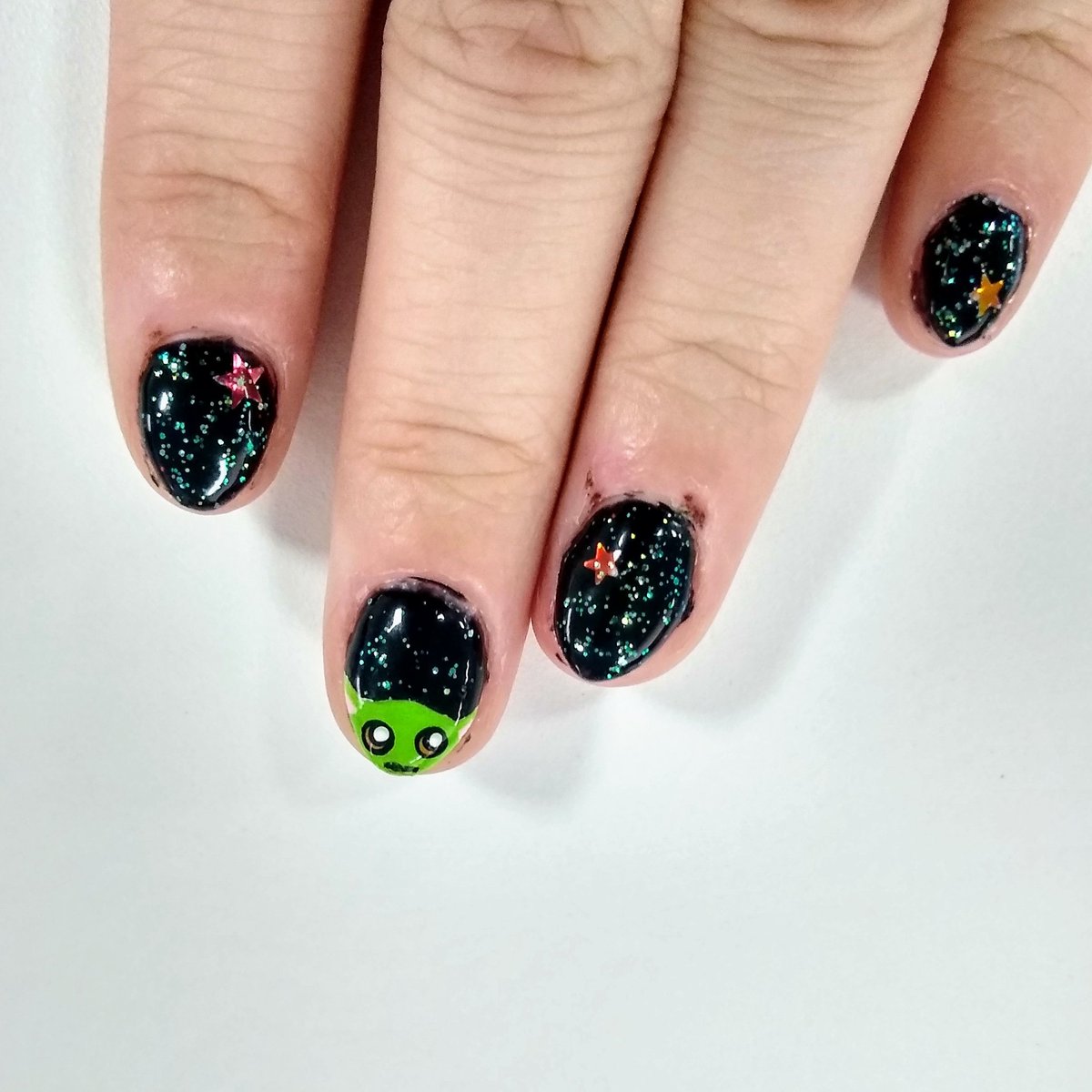 Baby Yoda painted on nails