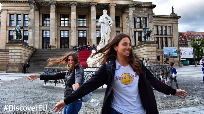Two girls outside historic landmark