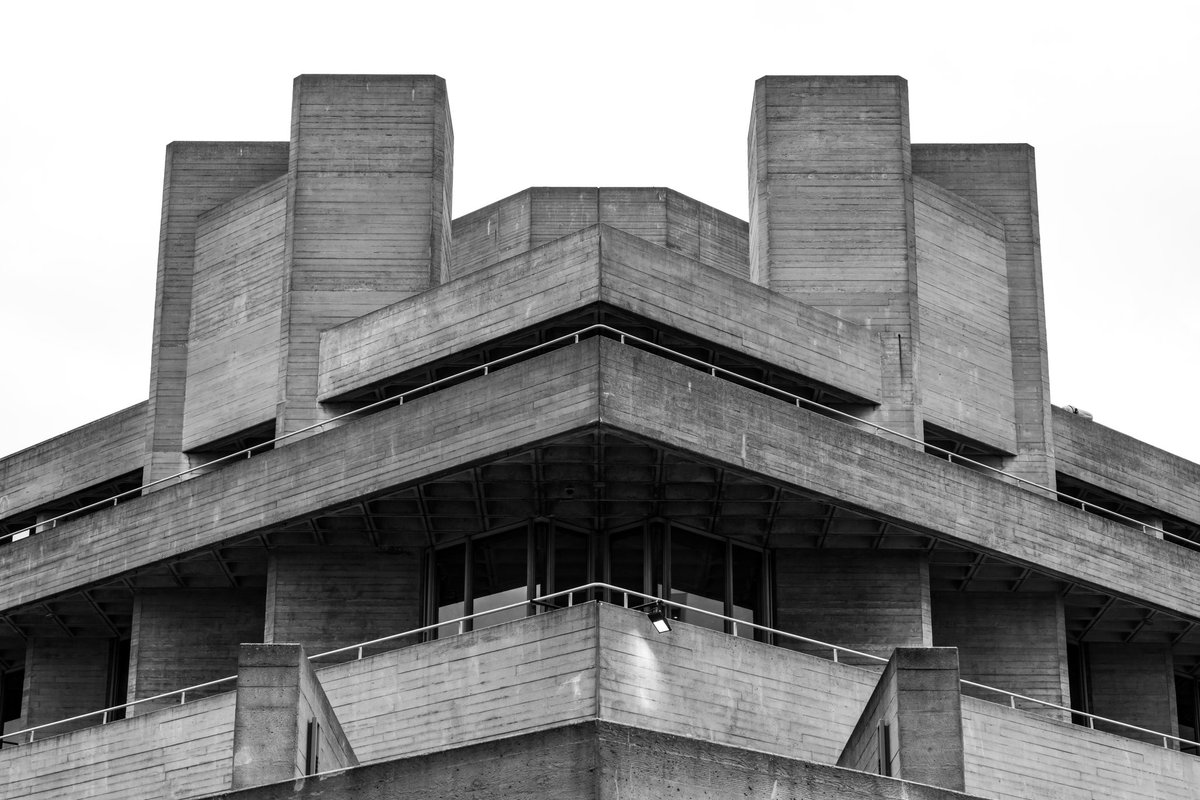 metasoar's tweet photo. a spotlight whispers to the dust - the monstrously #symmetrical #nationaltheatre in all its #brutalist glory. #london #brutalism https://t.co/dnVKfu8MYX