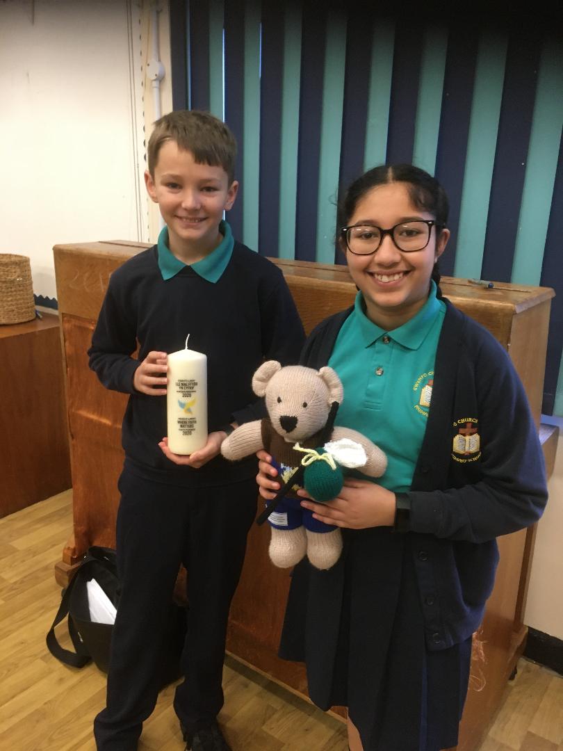 In celebration of 2020 being the #YearOfPilgrimage @LlandaffDio   the Pilgrimage Bear and Candle arrive @GwenfoCWPrimary @LlandaffEd  for assembly with Vicar Jon talking about #pilgrimage, shining out as a light to the world and #tellingaJoyfulStory