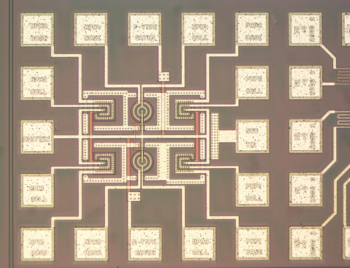 Test circuitry on an integrated circuit wafer. Square structures for NPN transistors and circular structures for planar PNP transistors.