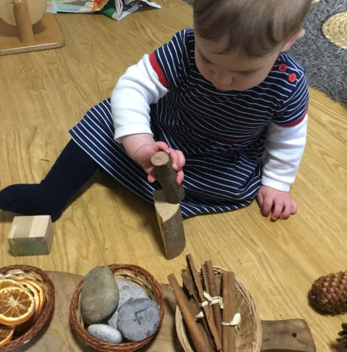 snapatworth's tweet photo. What do these natural resources smell like? Babies moved them around, building, smelling and exploring. #scented #cinnamonsticks #driedoranges https://t.co/iXM2EXr1F9