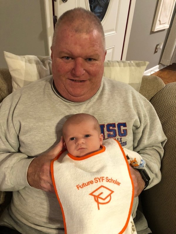 simon_youth's tweet photo. Congratulations to @AcademyHH Principal @BillyFellman on recently welcoming his first grandson into his family! This little cutie is rocking his SYF bib! https://t.co/PCSEMorPTr