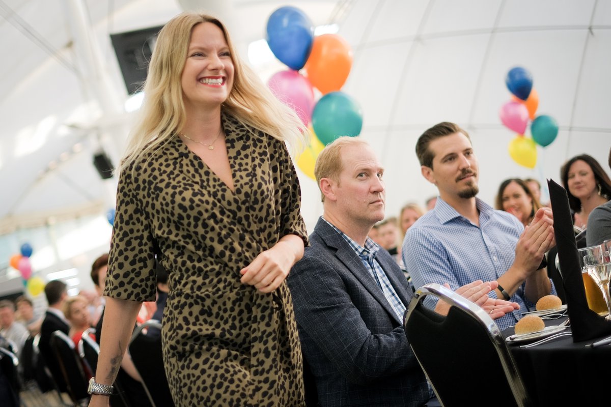 An ContentEd award winner walking to the stage.