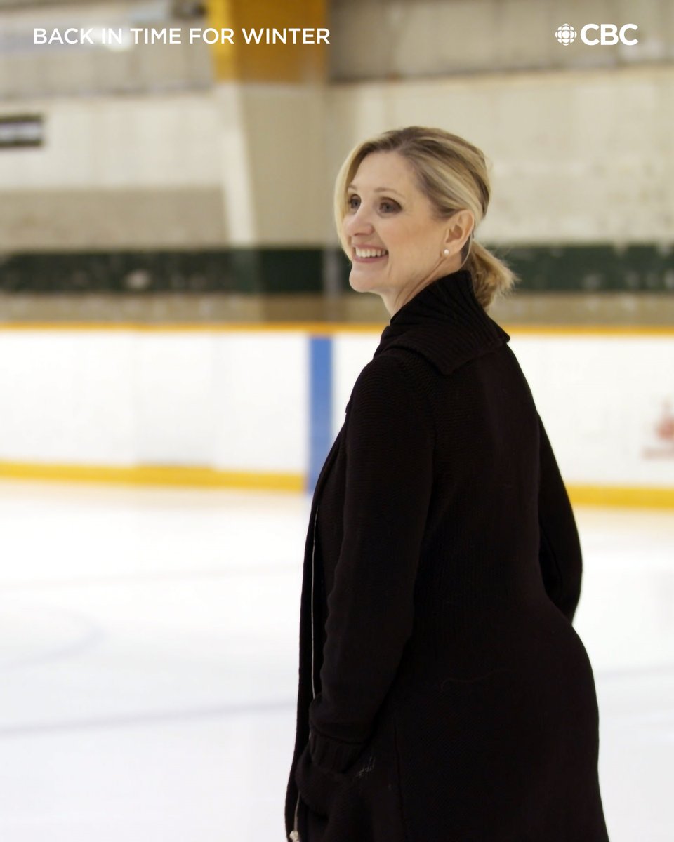 Sandra Bezic smiles while on an ice rink.