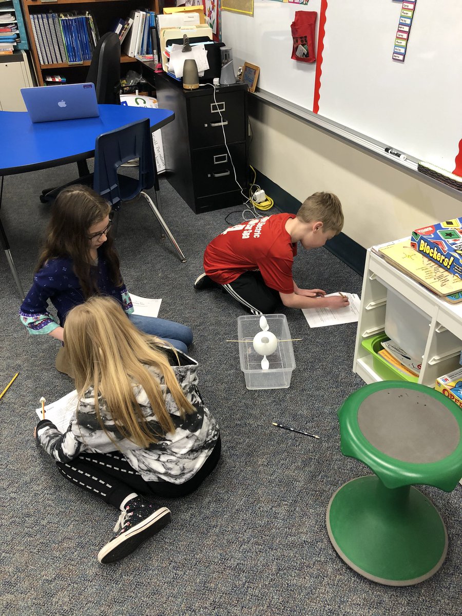 Students creating wind turbines to see how energy forms