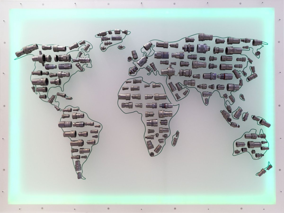 Lightbox installation made with Tube fittings laid out in the shape of the continents of the world - creating a super modernist neon light world map. As seen on Hannover Messe 2019 