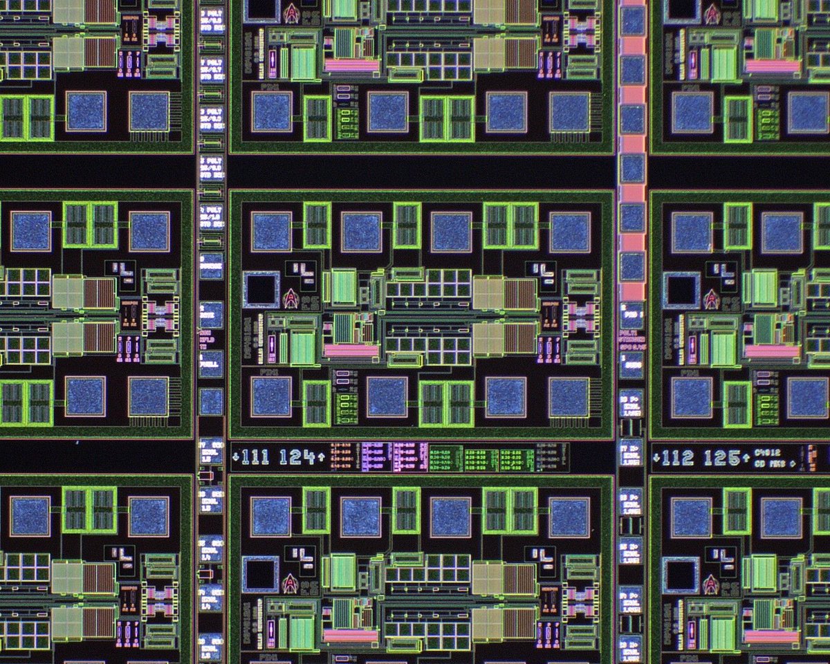 A close-up microscope photo of one of the wafers. It looks like abstract art