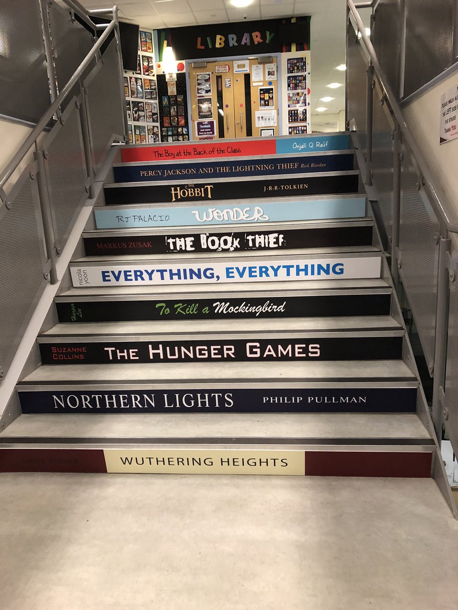 TCA_LRC's tweet photo. Our fabulous book staircase! @OnjaliRauf you are right at the top! #thisschoolreads #GreatSchoolLibraries https://t.co/wPjbXGSKsD