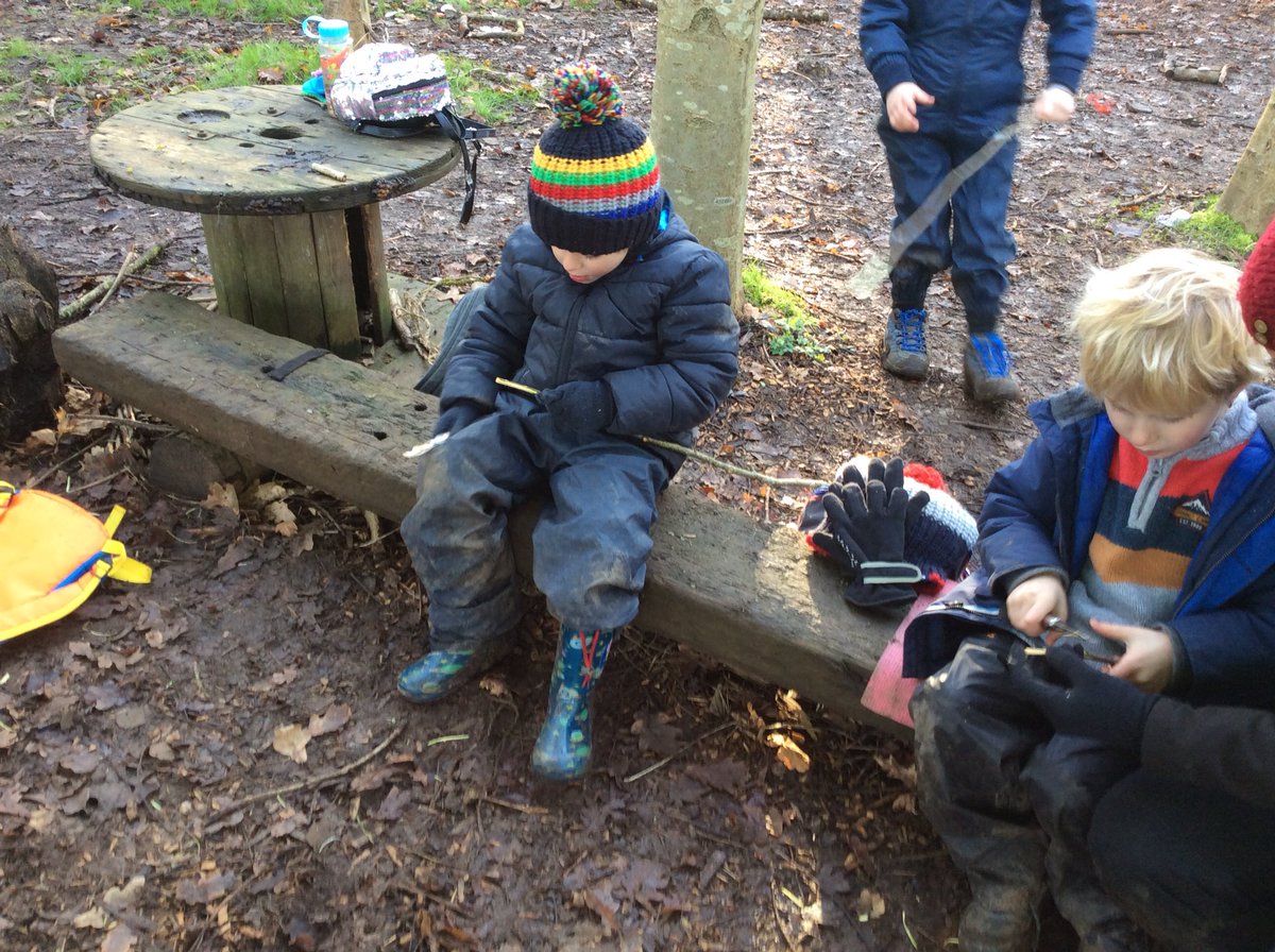Class 1 using flint and steels to light fires and toasting marshmallows on homemade toasting forks.