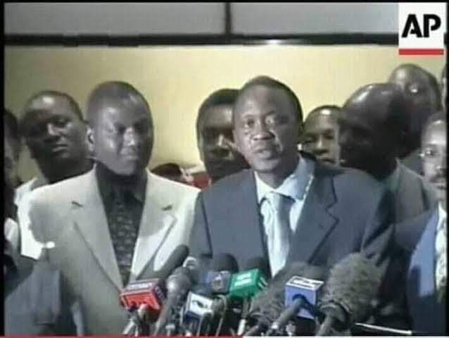 kipmurkomen's tweet photo. KANU Presidential candidate Hon. Uhuru Kenyatta conceding defeat after the 2002 General elections. Standing by him is his long time ally Hon.William Ruto. https://t.co/nt7tXFbt1g