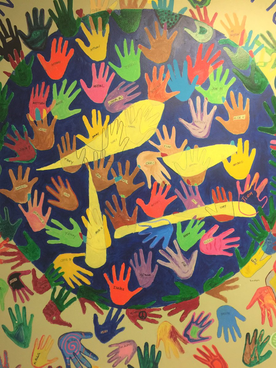 MaryvilleAcadem's tweet photo. We are very happy to welcome @FlashpointChi student James Cole to our #JenSchool campus today. Principal Ann Craig explains to James the Wall of Hands (and paws!) while Assistant Principal Heather Lischett listens. We'll share our exciting collab w/ #FlashpointChicago soon! https://t.co/G4juOKzJXq